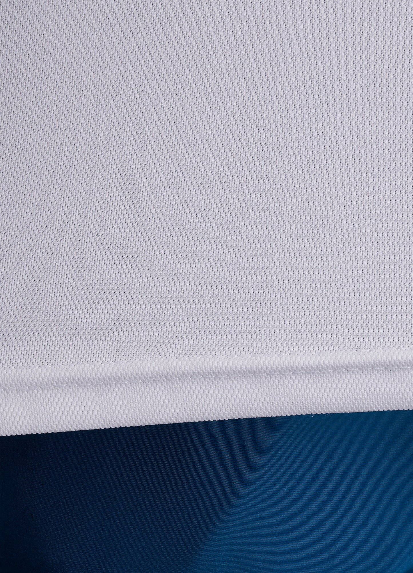 Close-up of ONCOURTANTICS white performance t-shirt fabric, highlighting lightweight, breathable material.
